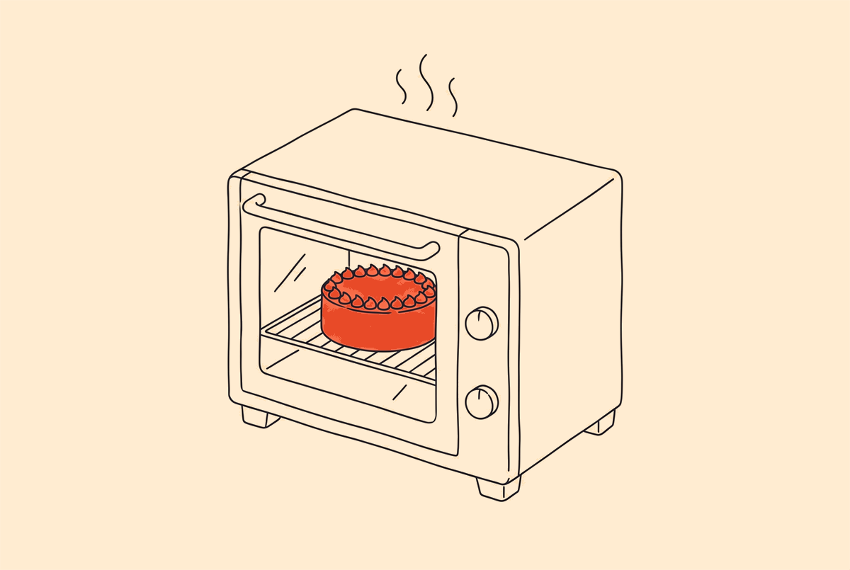 Een oven met de cake achter het deurraam.